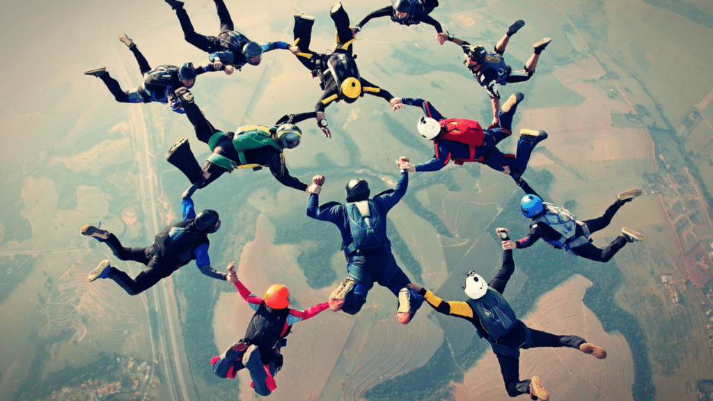 11 skydivers connected forming concentric circles