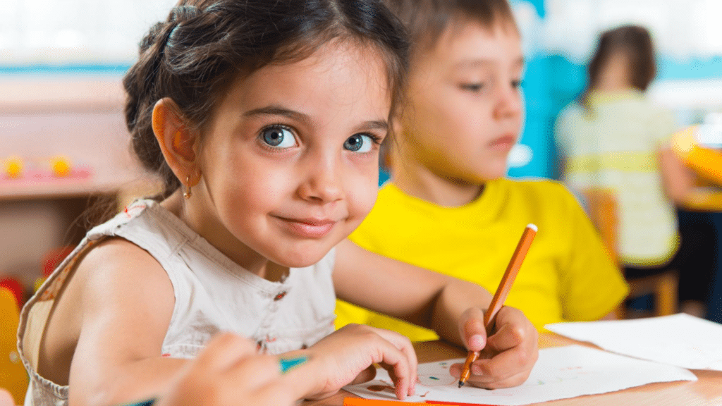 girl drawing classroom smile